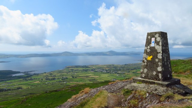 V8239 : On Seefin summit - Trig Point and view across Dunmanus Bay