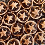 A cooling rack filled with star shaped pastries