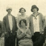 grayscale photo of 3 men and 2 women