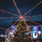 a large christmas tree in a city square