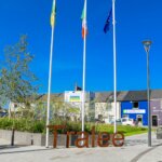 a sign that says trade in front of a building