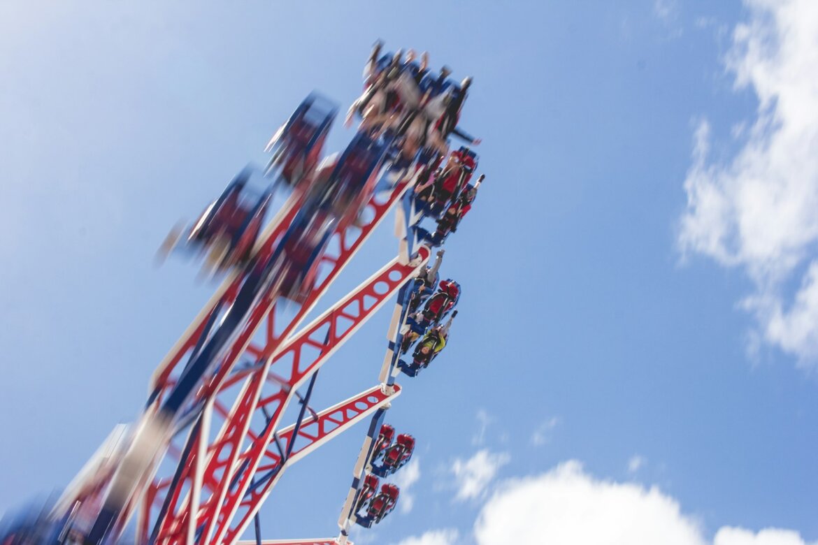 people riding of ferris wheel during daytime