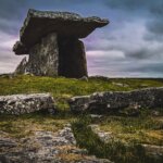 stone structure in green field
